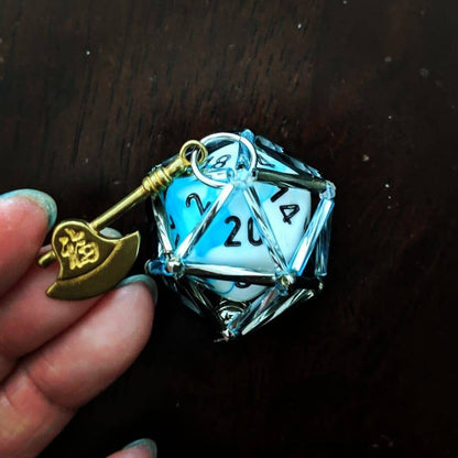 Grog necklace. Blue and gray D20 necklace with golden axe charm.